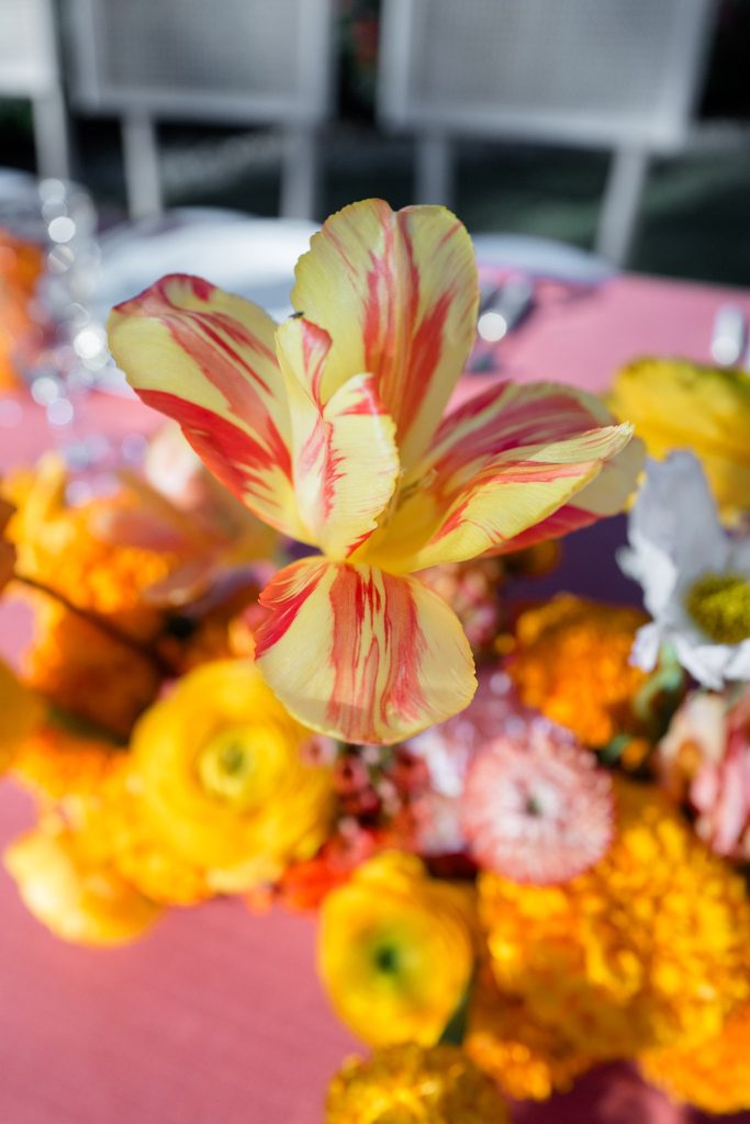 Textural fall floral design with parrot tulips and ranunculus by Snapdragon Atelier